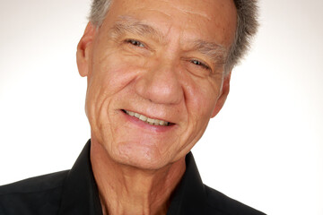 Portrait of an Older Man wearing a black shirt on a white background