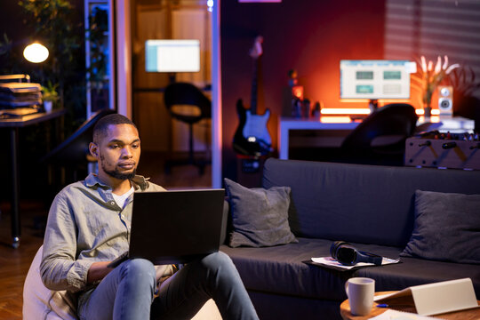 African american expert closing the monthly revenue balance on web platform, working remotely on accounting analysis. Financial analyst managing expenses and insurances before investing.