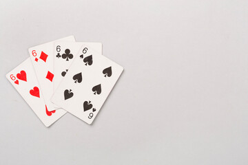 Poker chips and playing cards on color background, top view. Casino card game
