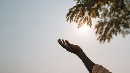 man captures sunbeam with his palm connecting deeply with nature and world around him