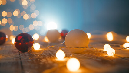 Christmas lights and a hand preparing the decorations with red and white balls