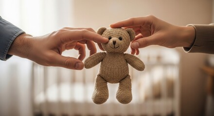 Holding teddy bear with hands, two people present stuffed animal indoors, soft toy ready for child. Holding teddy bear is a sign of affection and comfort, preparing room for kid.