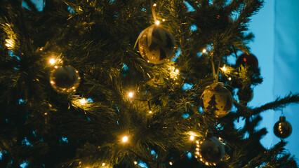 Christmas lights of a tree at night in the cozy room