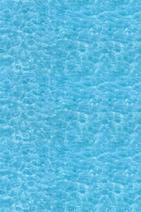 Water ripple seamless background texture - top view of clean, clear, blue water ripples. Image can be tiled to create a larger image or higher resolution background. Water has the chemical formula H2O