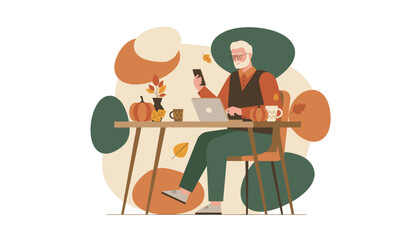 Senior man works remotely on laptop and phone at an autumndecorated desk