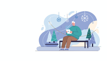 Happy senior man shopping online on a tablet enjoying the festive winter atmosphere