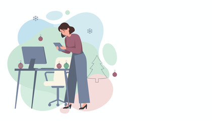 Woman using a digital tablet at a festive office desk decorated for Christmas Holiday business planning