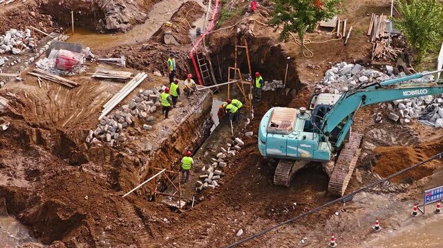 Workers constructing a small bridge foundation