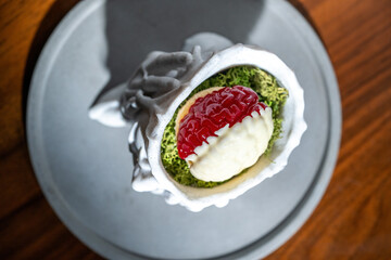 Spooky Halloween dessert with a brain-shaped treat in a skull-shaped dish