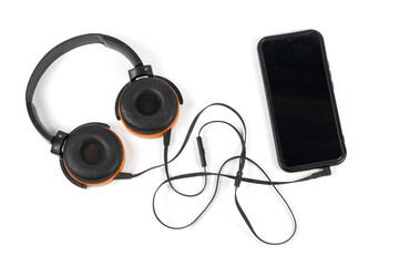 Still Life Modern Wireless Orange Headphones Connected to Smartphone isolated on white background
