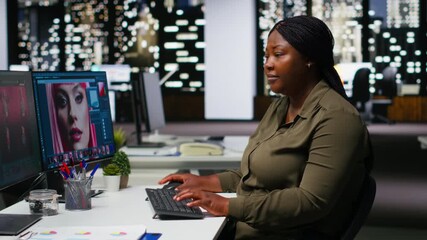 Woman expert developer works with photo editing software and AI, digital media retouching and generating content. Using dual monitors to ensure innovation in the graphic design world. Camera B.