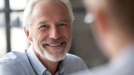 Elderly Smiling: An elderly gentleman with a distinguished, white beard radiates warmth and joy as he offers a captivating smile. His eyes reflect a life of experience and happiness.