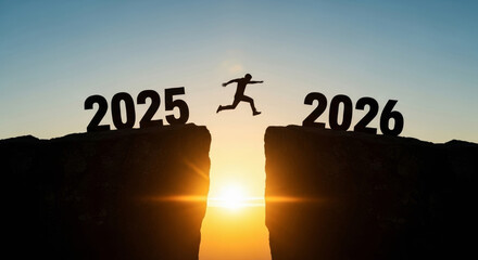 2026 business year end christmas new year person jumping cliff silhouette sunrise hopeful transition success