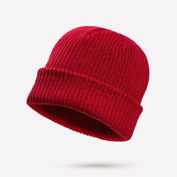 Deep red knitted winter beanie hat floating in air on light pastel background. Concept of cozy seasonal fashion, warm accessories, casual street style clothing for cold weather and outdoor lifestyle