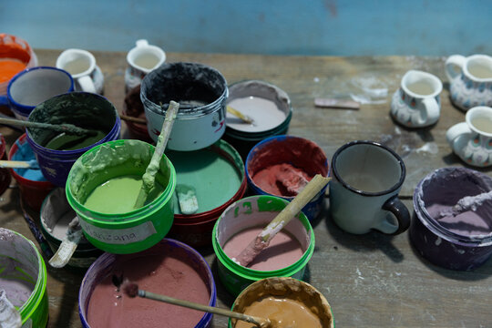 Messy paints in artisan studio in Guatemala