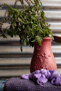 Traditional vase with herbs used to dye threads used for weaving in Guatemala