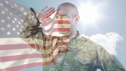 Soldier raising hand from helmet to forehead, saluting as flag overlay drifting, honoring nation