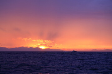 Fototapeta premium Magnificent sunset while sailing on a boat in the Aegean Sea.