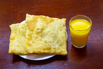 Fried Pastels, Brazilian-style street fair pastries, in an original and typical setting. Sugarcane juice, orange juice, and coconut water.