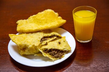 Fried Pastels, Brazilian-style street fair pastries, in an original and typical setting. Sugarcane juice, orange juice, and coconut water.