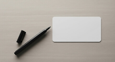 Top‑down of blank name tag with plain pen before writing