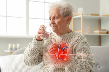 Elderly woman with heart attack taking medicine at home