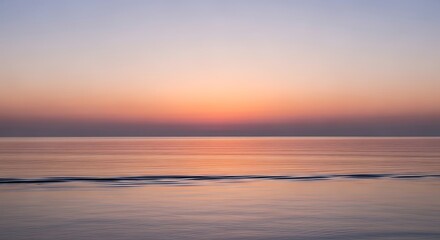 Fototapeta premium Serene Sunset Over Calm Ocean Waters with Soft Hues.