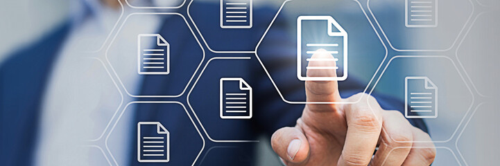 Man interacts with digital documents on a touch interface highlighting data management and workflow automation in a modern business environment for efficient document control and access