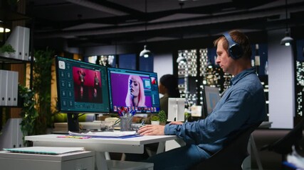Graphic developer working with photo editing software at the office, digital media production with professional tools. Dual monitors for productivity in the graphic design industry. Camera A.