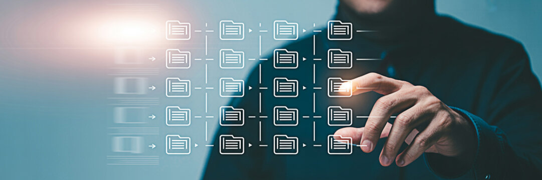 Man interacts with a digital interface displaying file management system showcasing data organization cloud storage and network connectivity for business and personal use cases