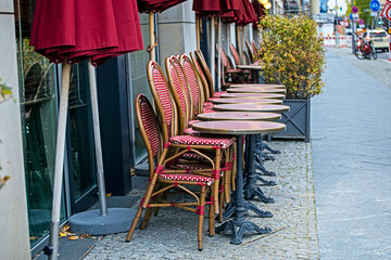 stacking of chairs and tables at a street cafe in front of the Doge