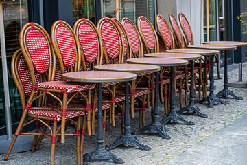 stacking of chairs and tables at a street cafe in front of the Doge