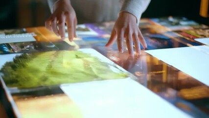 Creative professional reviewing multiple print layout options on a digital interface highlighting AI softwares role in economical print production.