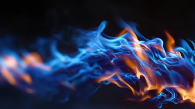 A vibrant abstract image of dancing, layered blue and orange flames against a dark backdrop