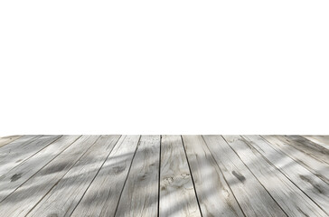 Weathered wooden planks with dappled shadows create a rustic surface.