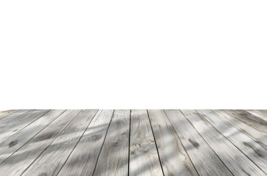 Weathered wooden planks with dappled shadows create a rustic surface.