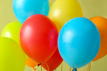 Colorful air balloons on green background, closeup