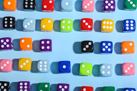 Colorful game dices on blue background