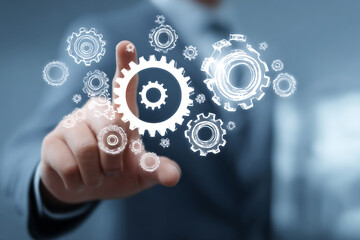 Digital Gear Diagram Activated by Businessman for Business Development