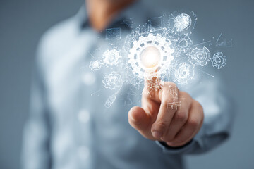 Businessman Touching Digital Cogwheel Interface for Innovation Concept