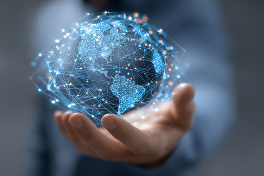 Global Business Connection: Hand Holding a Glowing Digital Earth Globe with Polygons and Network Lines.