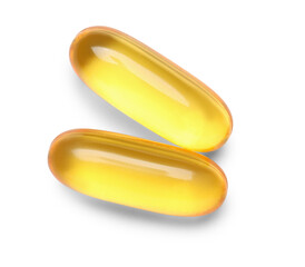 Vitamin E capsules on white background