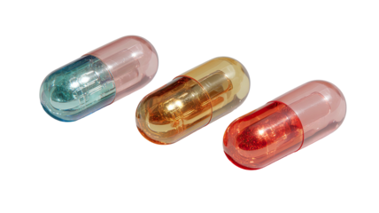 Three translucent capsules, blue, orange, and red, on a black backdrop