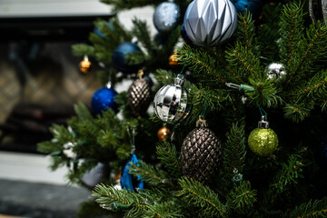 Artificial Christmas tree with silver and blue ornaments