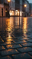 A close-up view of a wet cobblestone street illuminated by warm streetlights during a rainy evening in an urban setting