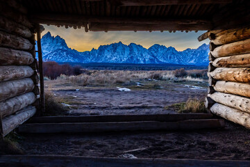 Gorgeous View of the Sunset behind the Tetons through the J.P. Cunningham Cabin at Grand Teton National Park