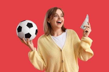 Happy young woman with soccer ball and money on red background. Sports bet concept
