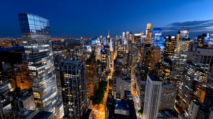 Vibrant cityscape glows beneath dark sky, lights creating sense of awe and wonder at urban landscape