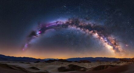 Stunning milky way arching over desert landscape under starry night sky