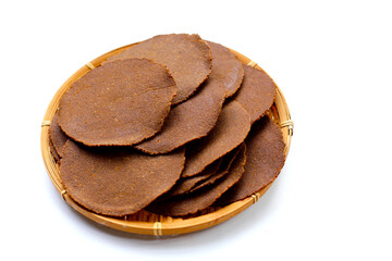 Fermented soybean discs, known as “Thua Nao,” a traditional Thai seasoning used to enhance flavor in Northern cuisine.
